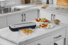 Load image into Gallery viewer, FoodSaver FFS005X Vacuum Sealer with Storage Compartment for Roll and Cutter, Pulse Function for Fragile Food, Includes Matching Accessories and Vacuum Bags